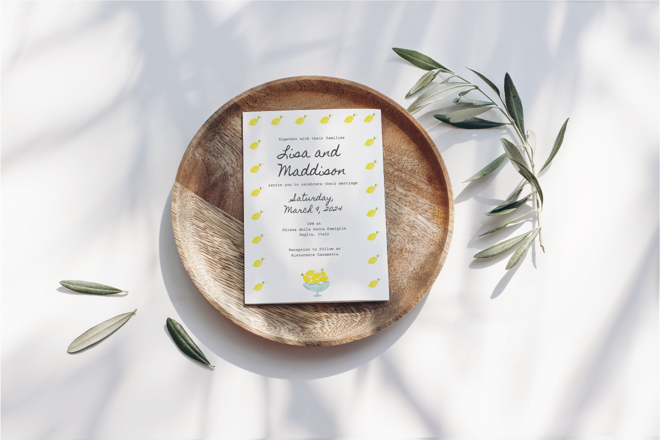 Hand-painted watercolor wedding invitation with Sicilian lemons and olive branches.